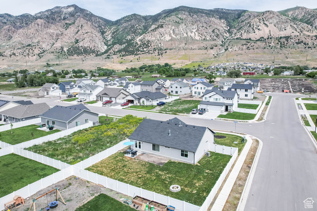 Aerial perspective of suburban area featuring a mountain backdrop