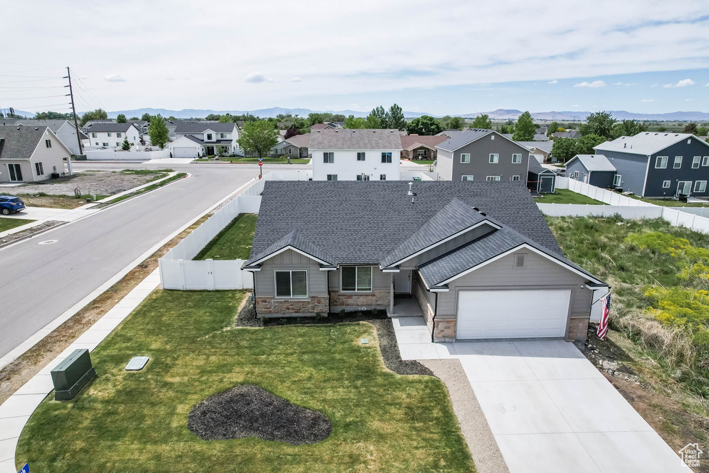 Aerial view of residential area featuring a mountainous background