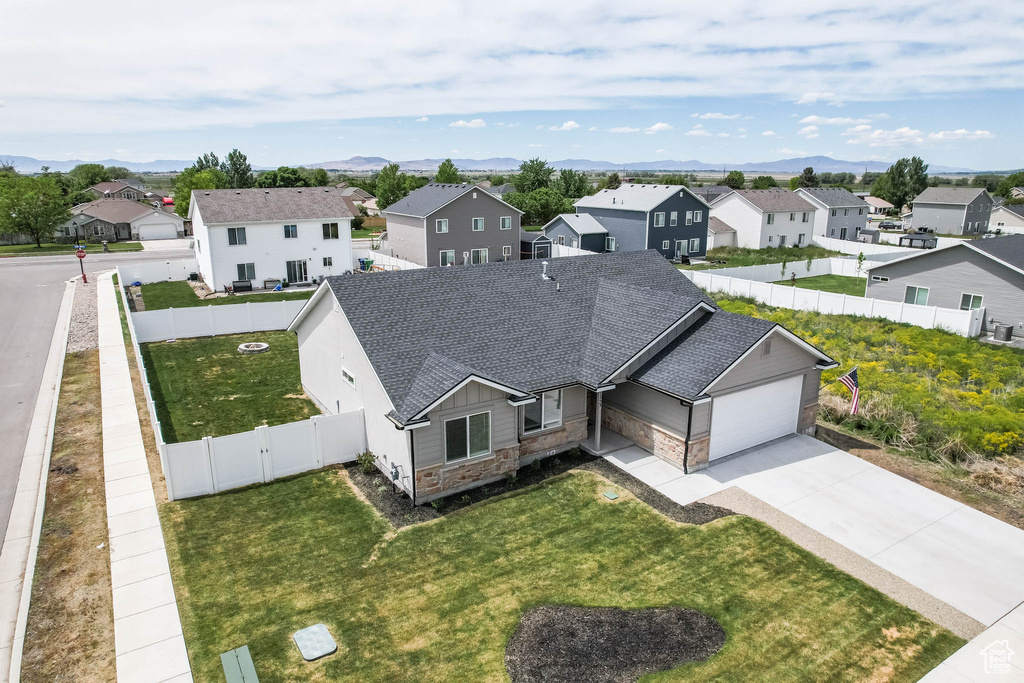 Aerial view of residential area with a mountainous background