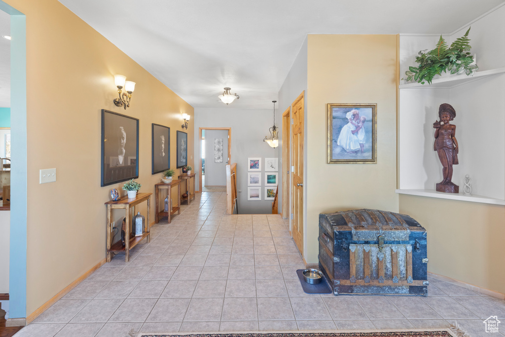 Hall with tile patterned flooring