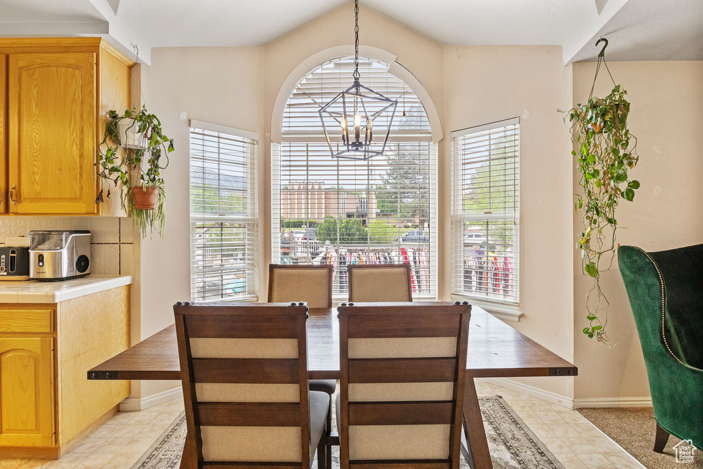 Dining room with a chandelier and baseboards