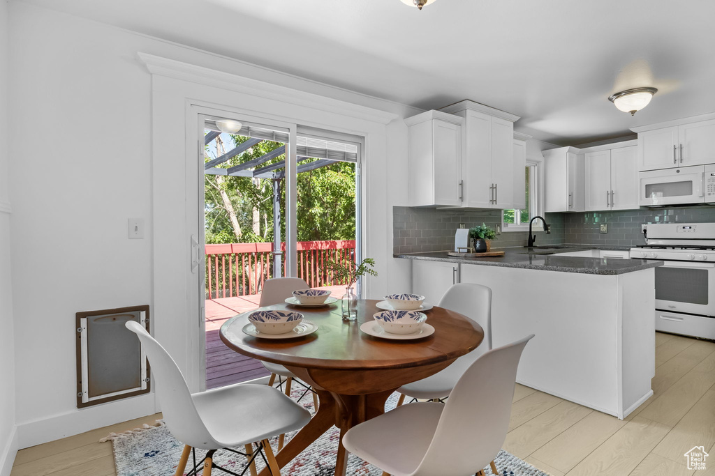 Dining room with light wood-style floors