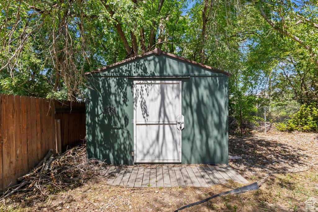 View of shed featuring a fenced backyard