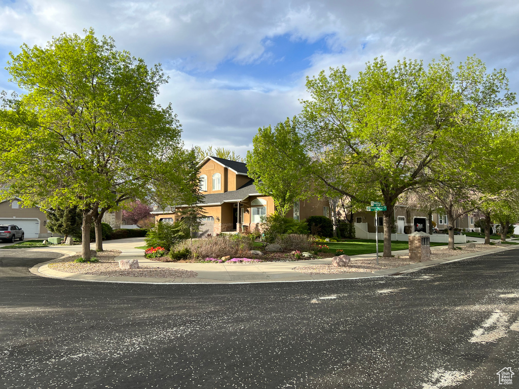 Obstructed view of property featuring roof with shingles