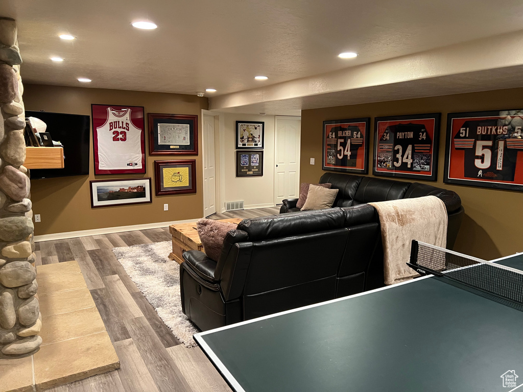 Cinema featuring recessed lighting, wood finished floors, and baseboards