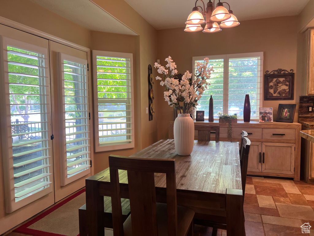 Dining area featuring a chandelier and plenty of natural light