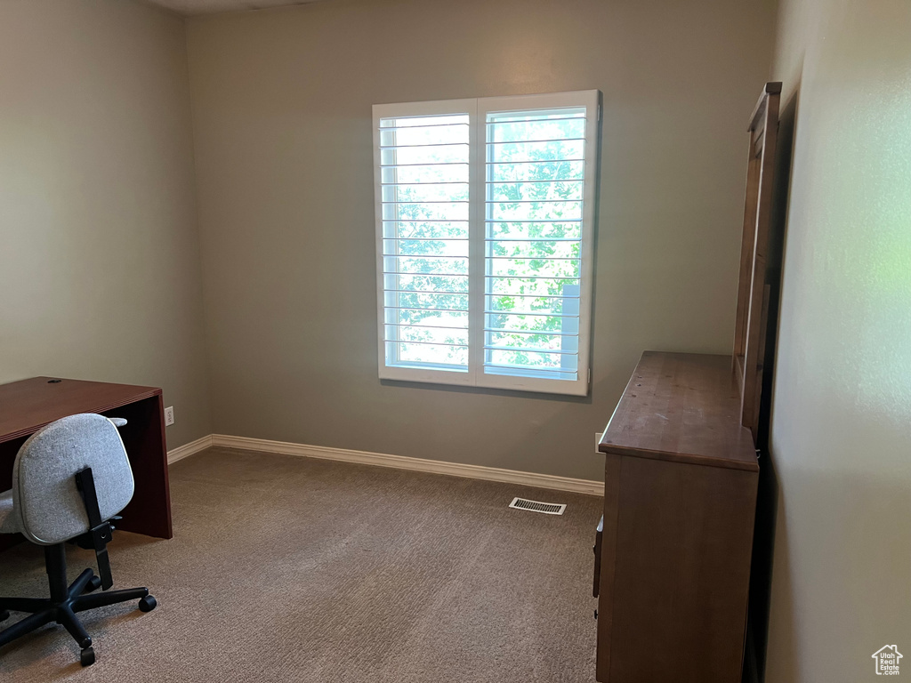 Unfurnished office with carpet and baseboards
