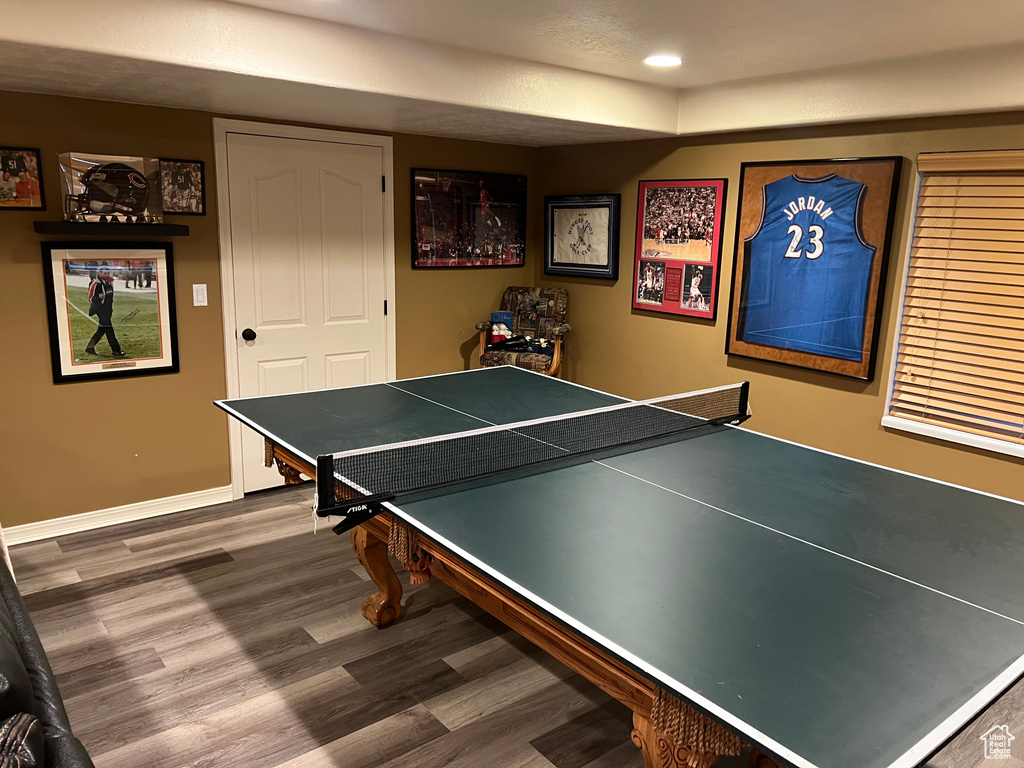 Game room featuring wood finished floors, recessed lighting, and baseboards
