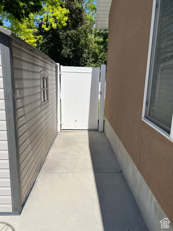 View of patio with a gate