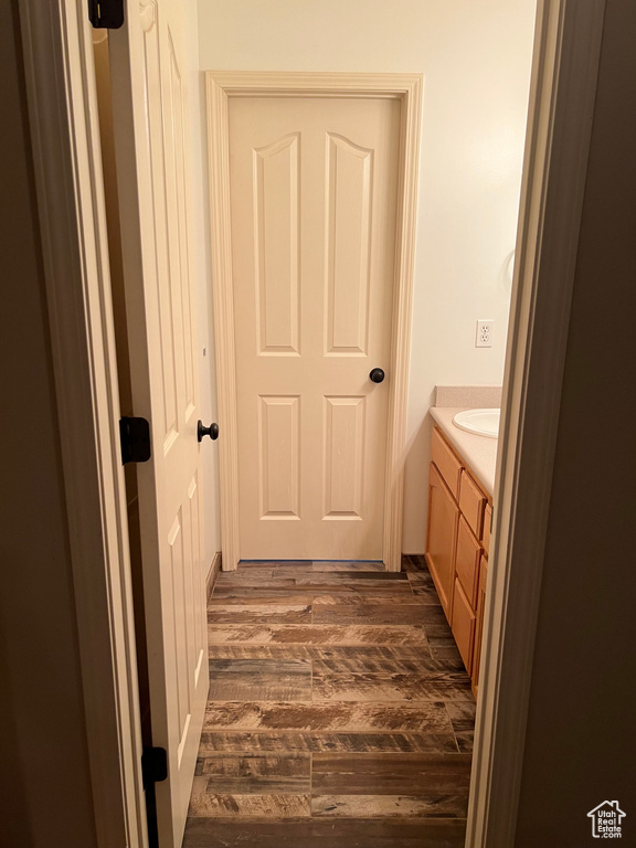 Bathroom featuring vanity and wood-type flooring