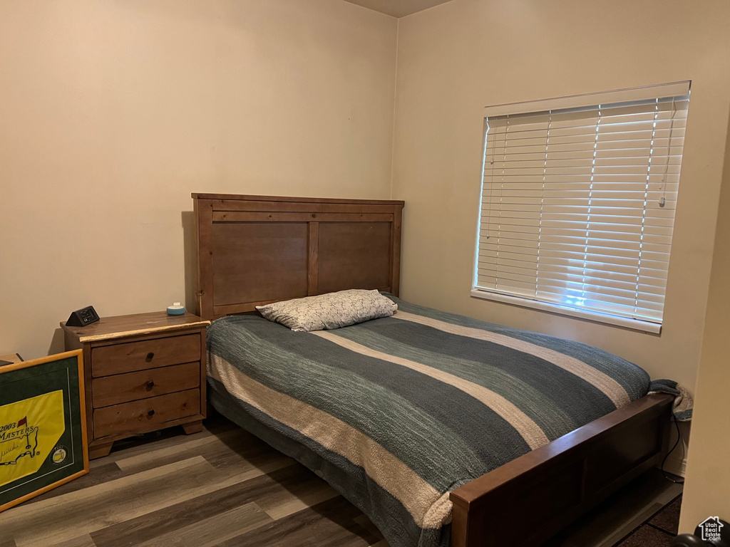 Bedroom with wood finished floors