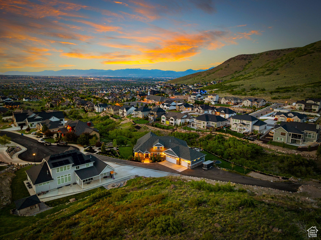 Aerial view at dusk of a residential view and a mountain view