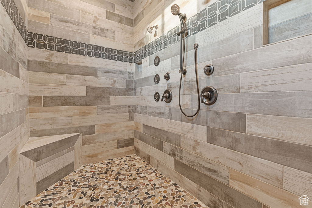 Full bath with tiled shower