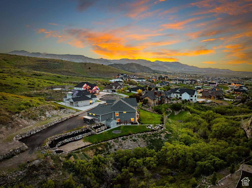 Aerial view at dusk of a residential view and a mountain view