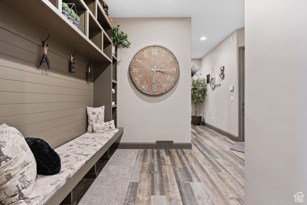 Mudroom with wood finished floors, recessed lighting, and baseboards