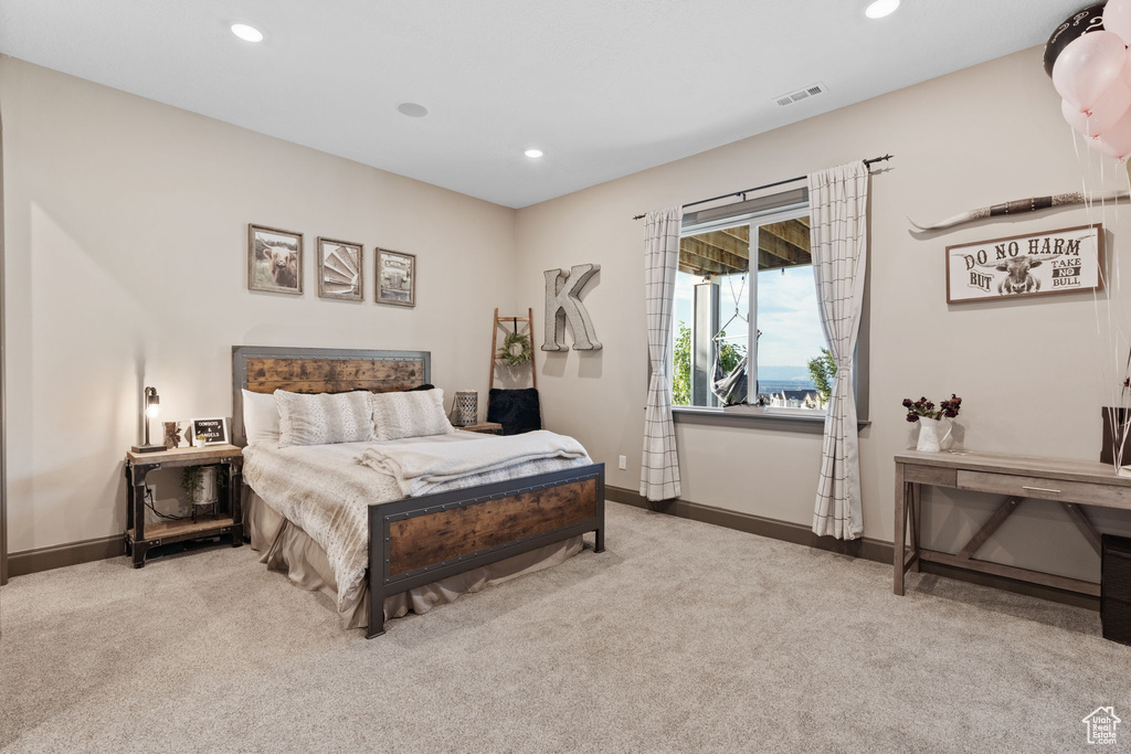 Bedroom with carpet flooring, baseboards, and recessed lighting