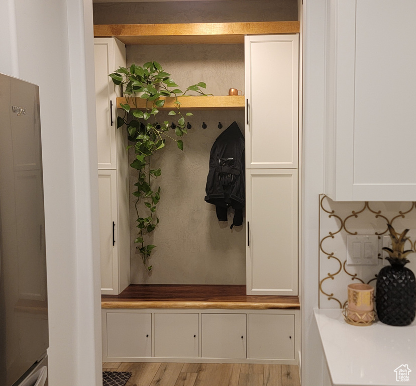 Mudroom featuring light wood-type flooring