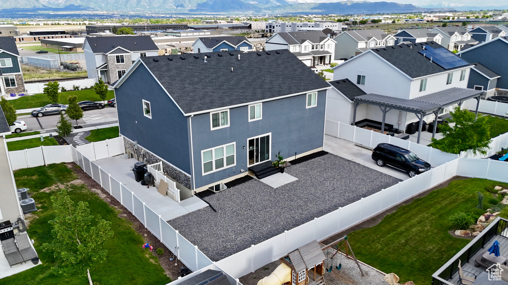 Aerial view of residential area featuring mountains