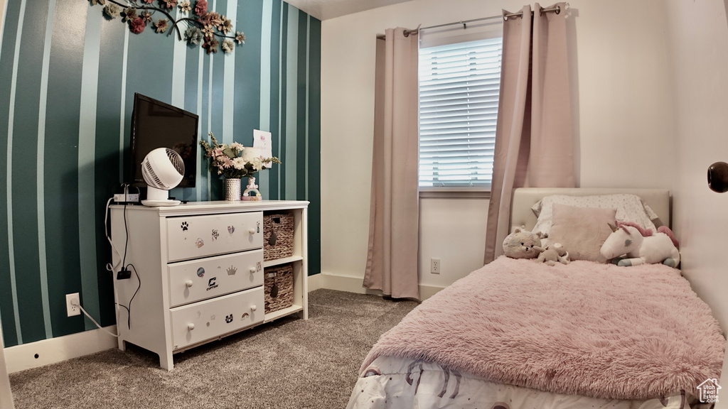 Carpeted bedroom with baseboards