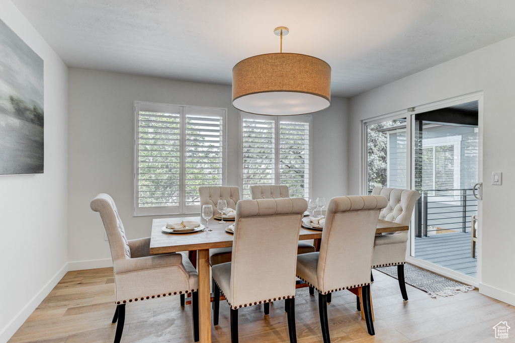 Dining area featuring wood finished floors and baseboards
