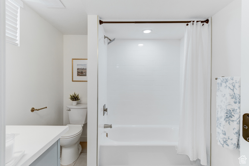Bathroom with vanity, toilet, shower / bath combo, recessed lighting, and tile patterned floors