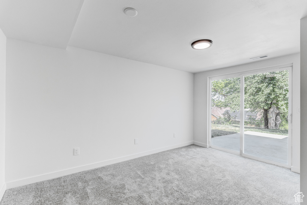 Unfurnished room with carpet and baseboards