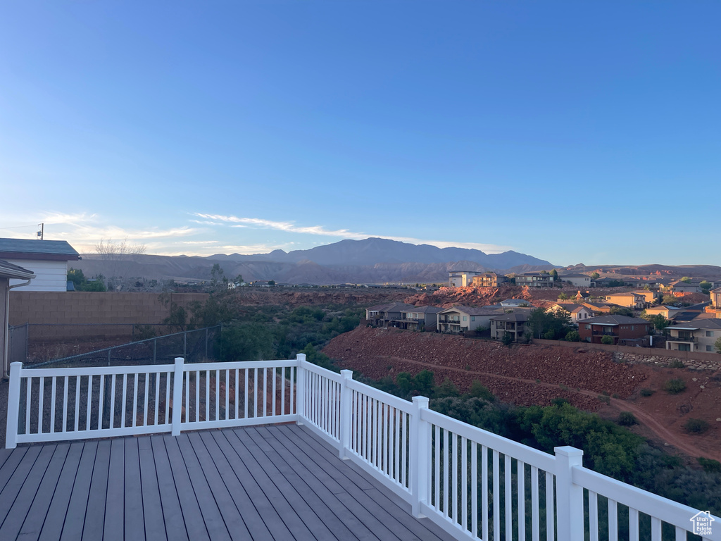 Wooden terrace featuring a mountain view