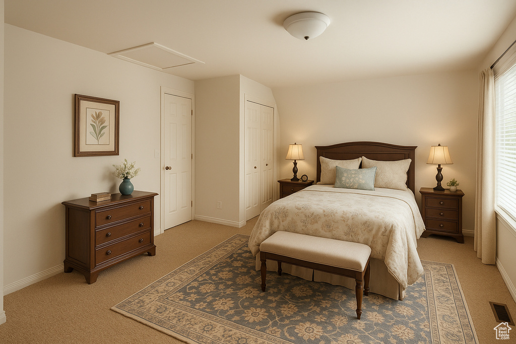 Bedroom with attic access, light carpet, baseboards, and a closet