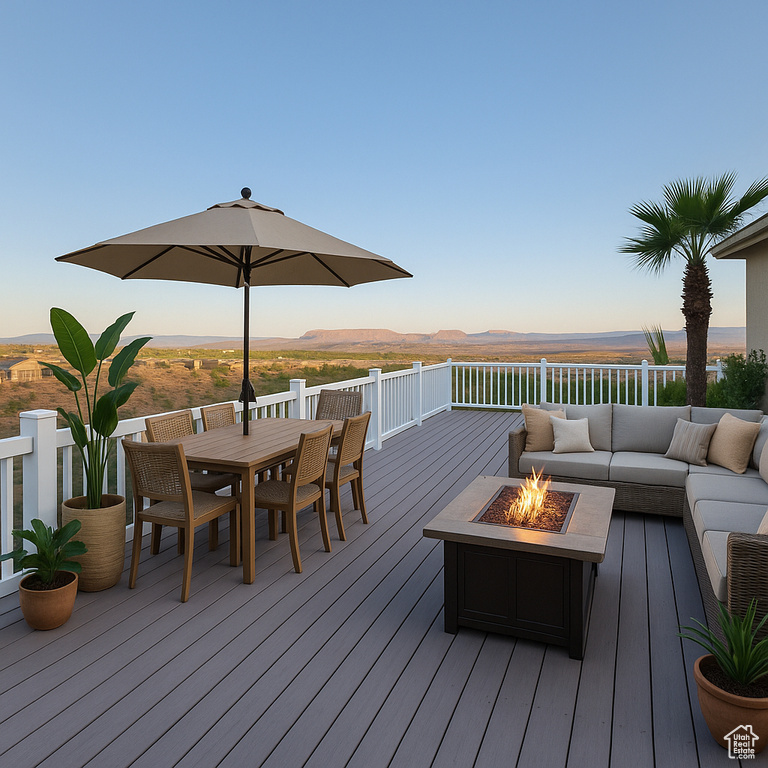 Deck with an outdoor living space with a fire pit and outdoor dining area