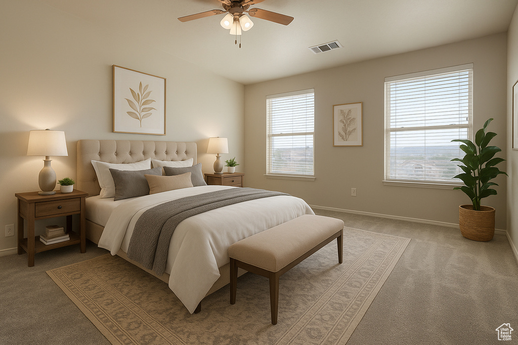 Bedroom with light carpet, baseboards, and a ceiling fan