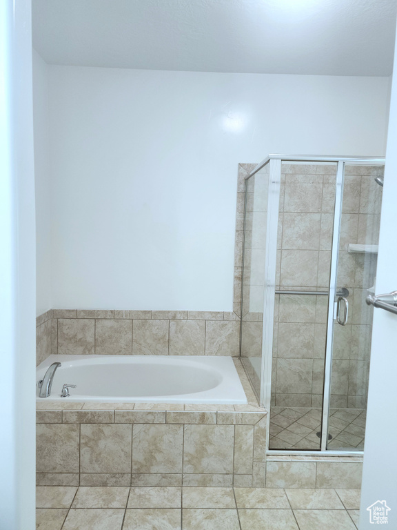 Full bathroom with a bath and a shower stall