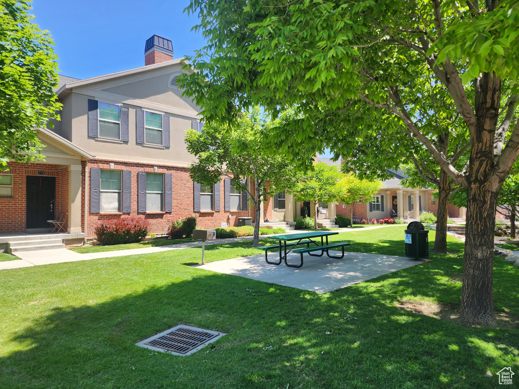 View of home\'s community featuring a yard