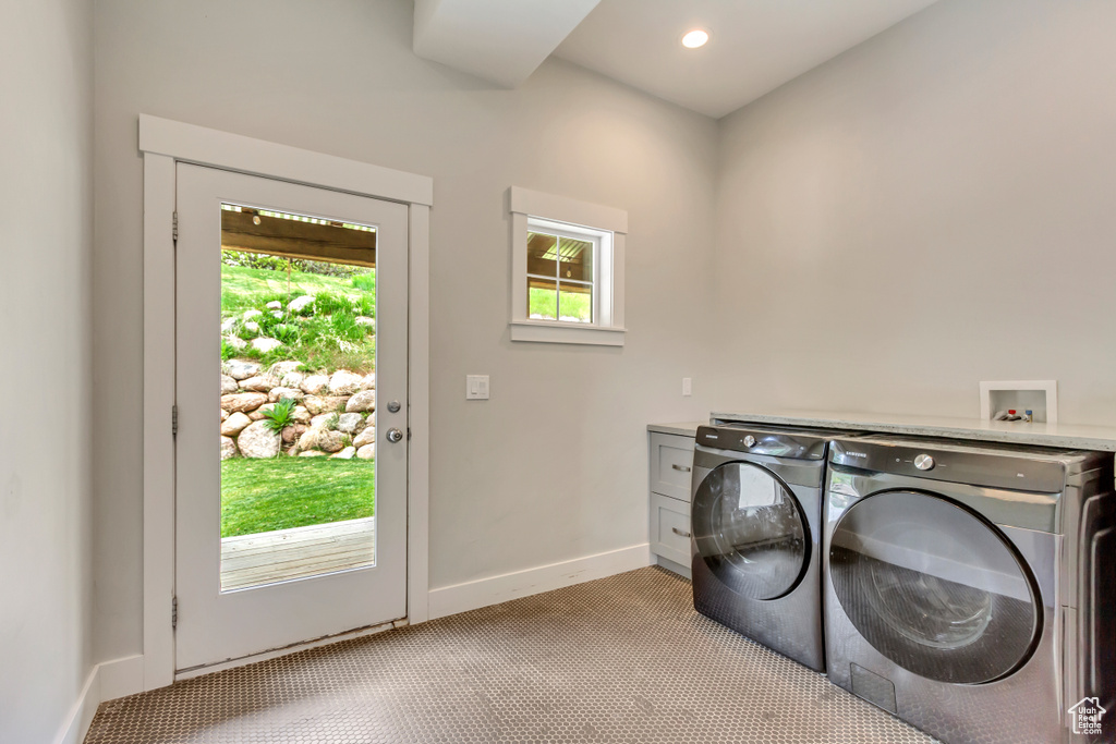 Laundry room featuring independent washer and dryer, light carpet, baseboards, and recessed lighting