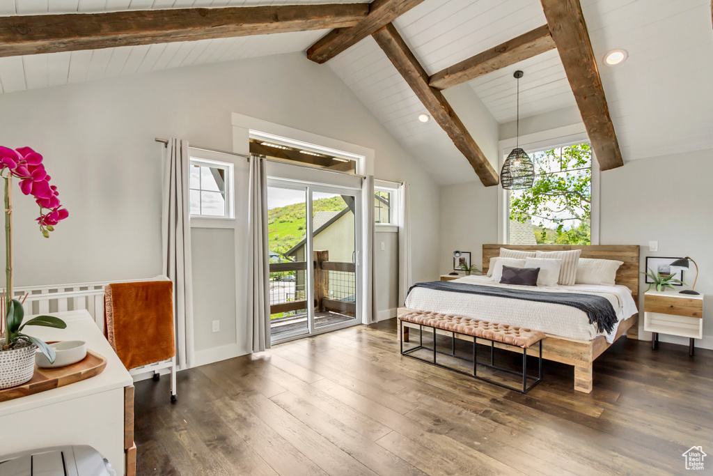 Bedroom with access to outside, multiple windows, hardwood / wood-style flooring, and recessed lighting