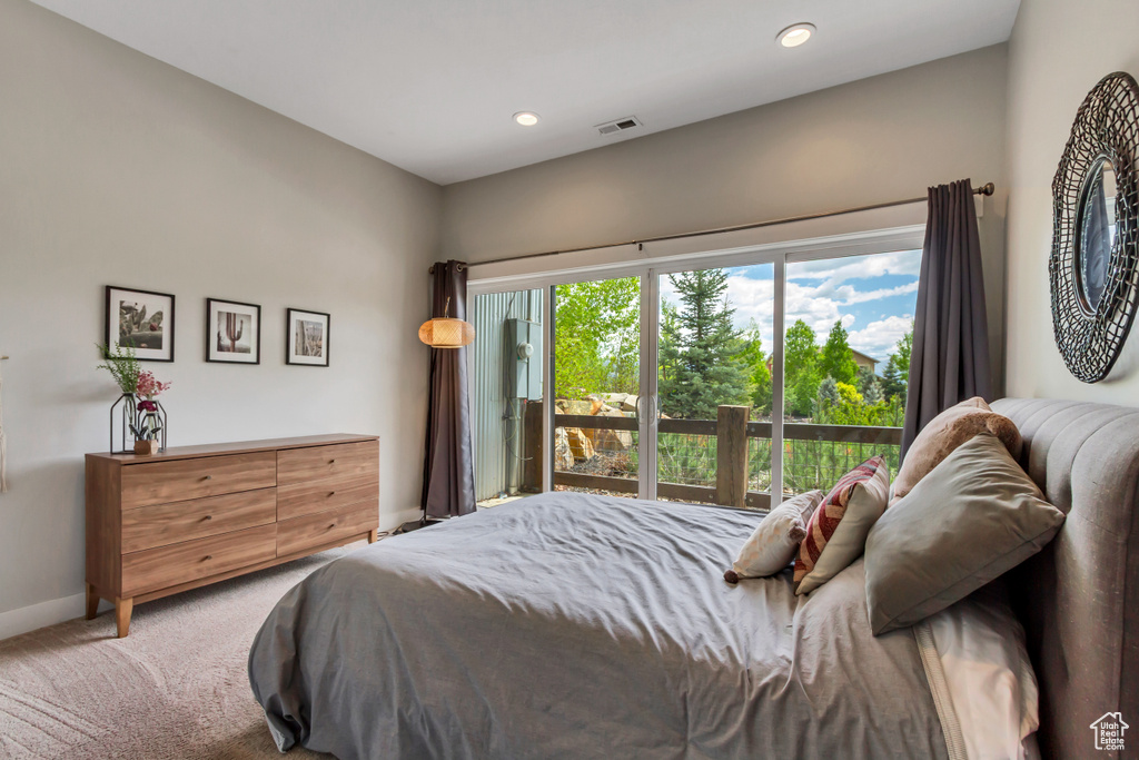 Carpeted bedroom with baseboards and recessed lighting