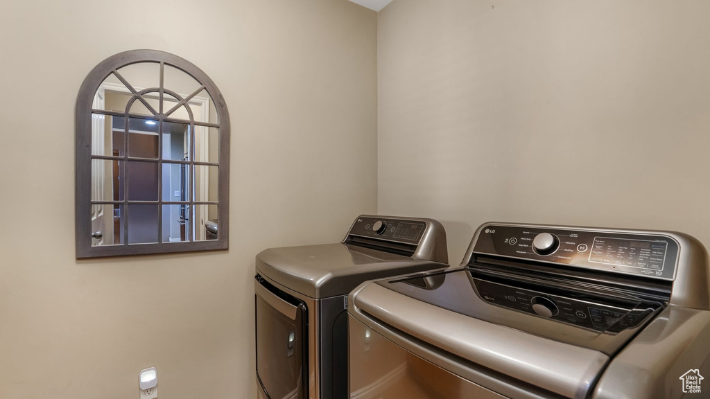 Laundry room featuring washer and clothes dryer