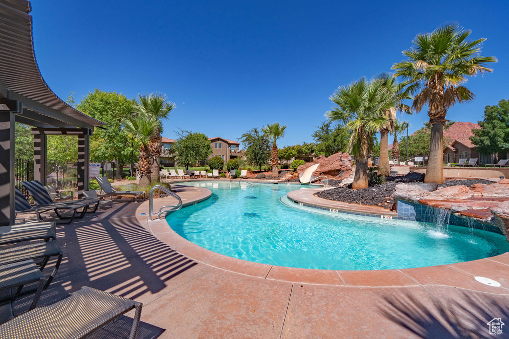 Community pool featuring a patio