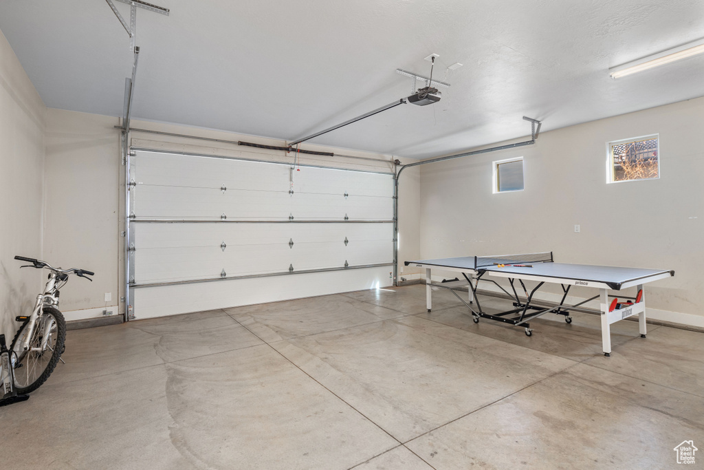 Garage featuring a garage door opener