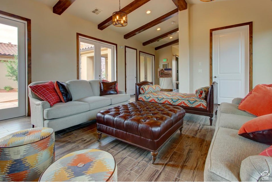 Living room with wood finished floors, recessed lighting, and plenty of natural light