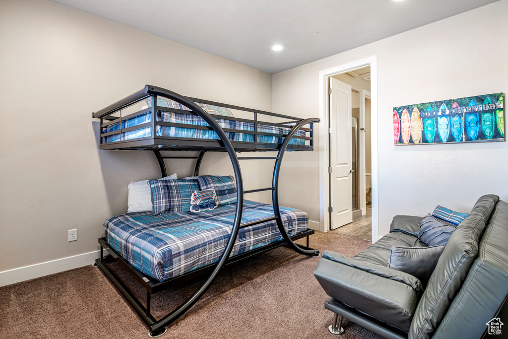 Carpeted bedroom featuring baseboards and recessed lighting