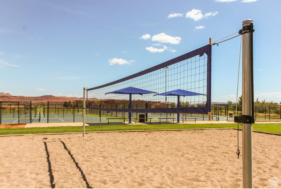 View of community featuring volleyball court and a tennis court