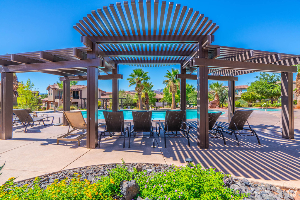 View of patio / terrace with a pergola and an outdoor pool