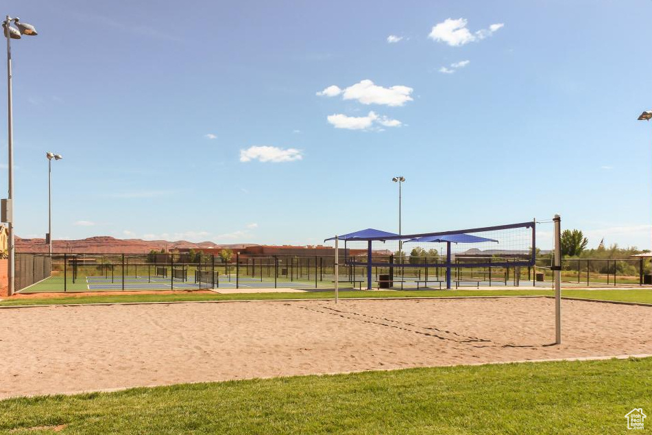 Surrounding community with volleyball court and a tennis court