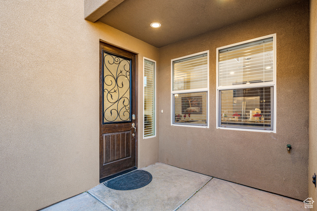Entrance to property featuring stucco siding