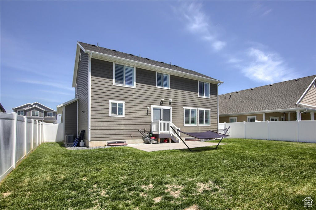 Back of house featuring a patio area and central air condition unit