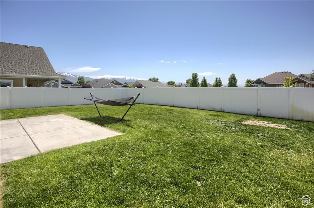 View of yard with a patio area