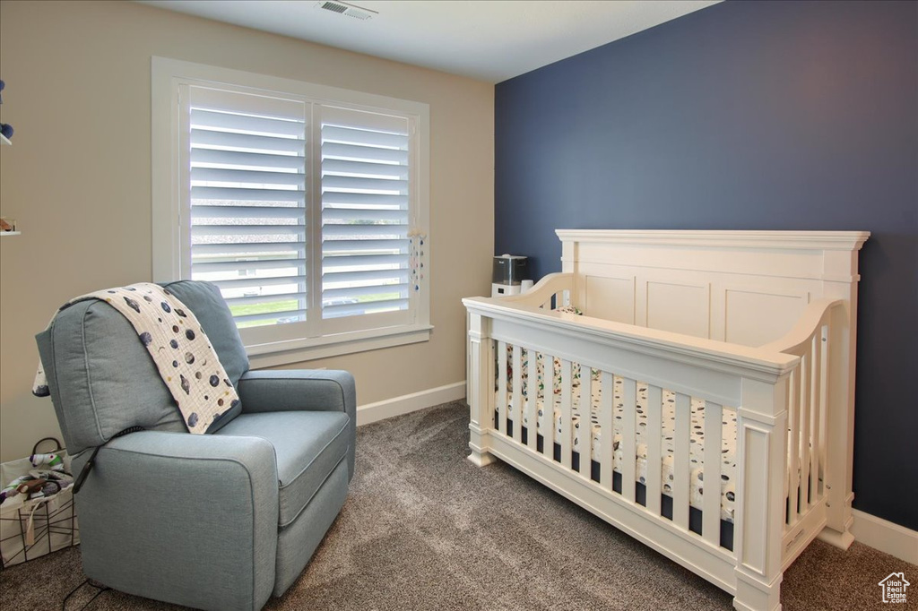 Carpeted bedroom featuring baseboards