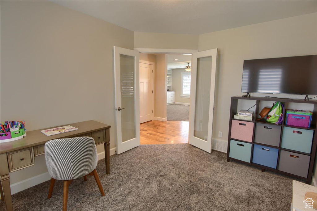 Office area featuring carpet flooring, french doors, and baseboards