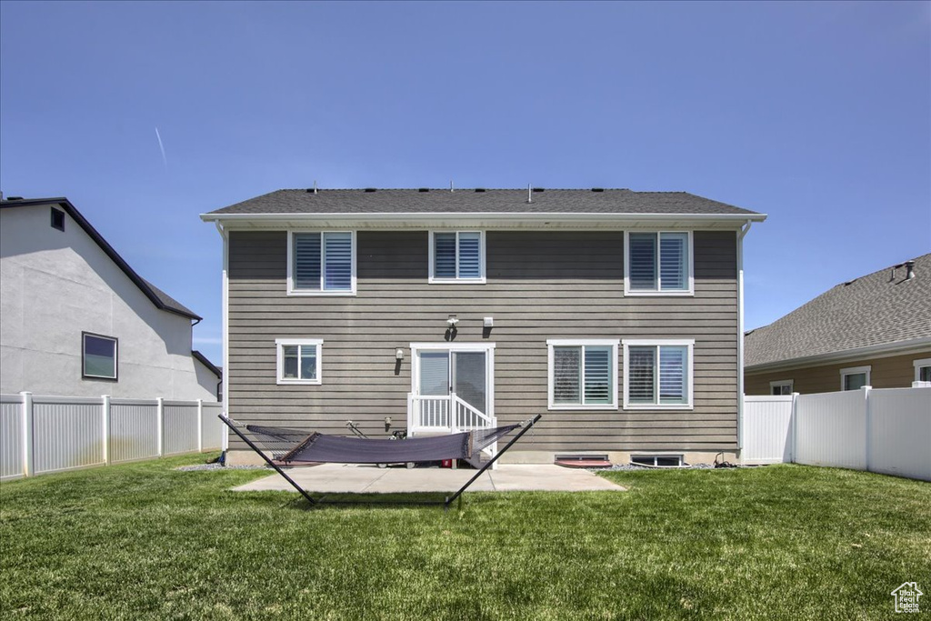 Rear view of house with a patio