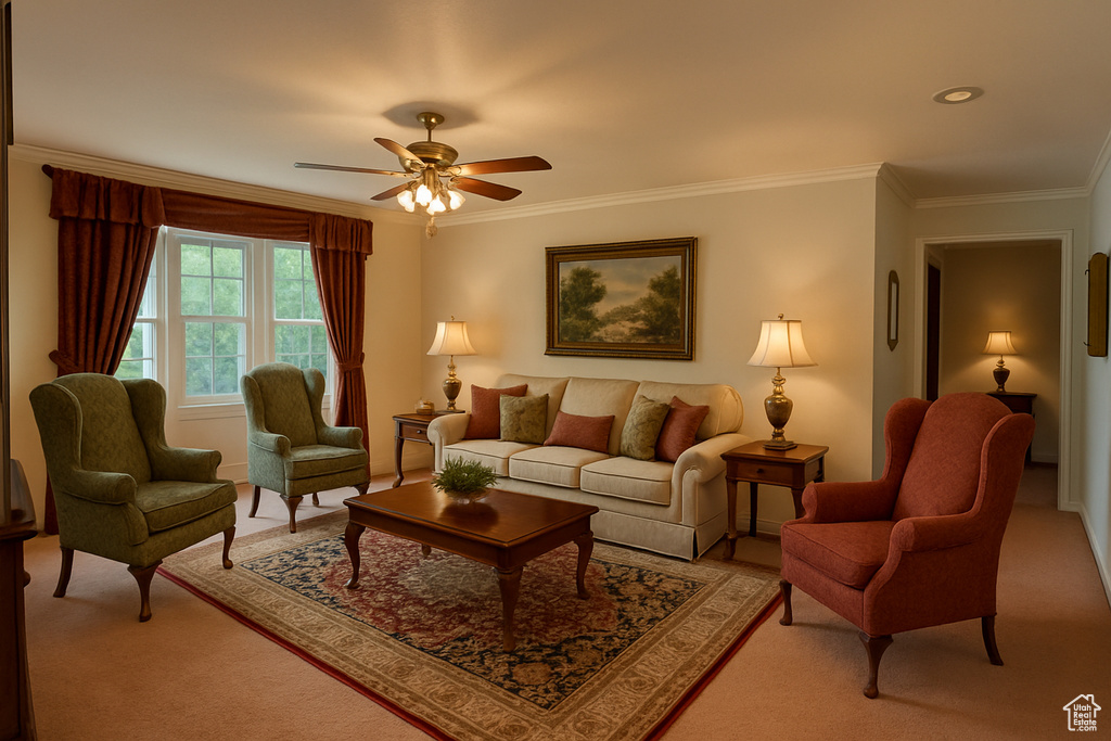 Living area with light carpet, ornamental molding, and ceiling fan